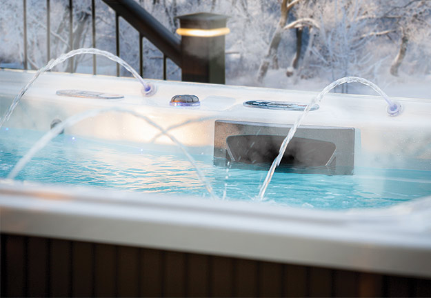 A Michael Phelps Signature Series Swim Spa stays warm despite the open winter air with a variety of insulation features.